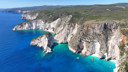 Aerial drone photo of scenic viewpoint of Plakaki beach featuring amazing sea caves and white...