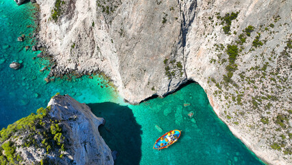 Aerial drone photo of scenic viewpoint of Plakaki beach featuring amazing sea caves and white...