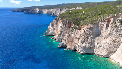 Aerial drone photo of scenic paradise bay with white rocky seascape forming small caves surrounded...