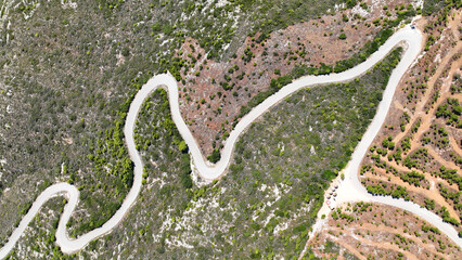 Aerial drone top down serpentine mountain scenic zig zag road with 