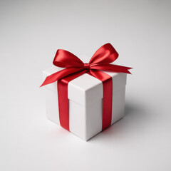 Obraz premium White gift box with red ribbon a present for Christmas or birthday isolated on white background