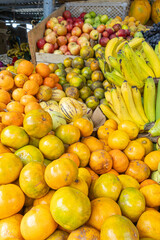 Colorful display of fresh fruits at the Otavalo market, Ecuador. A vibrant scene that conveys freshness, abundance, and natural flavor.