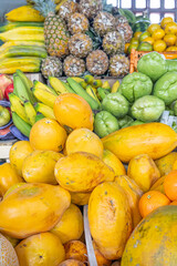 Colorful display of fresh fruits at the Otavalo market, Ecuador. A vibrant scene that conveys freshness, abundance, and natural flavor.