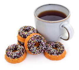 Cup of coffee with chocolate donuts and colorful sprinkles