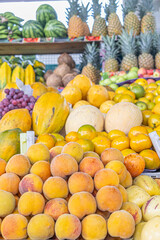 Colorful display of fresh fruits at the Otavalo market, Ecuador. A vibrant scene that conveys freshness, abundance, and natural flavor.