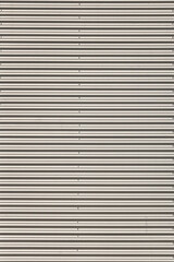 Obraz premium White metal horizontal industrial blinds with electric drive