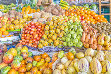 Colorful display of fresh fruits at the Otavalo market, Ecuador. A vibrant scene that conveys freshness, abundance, and natural flavor.