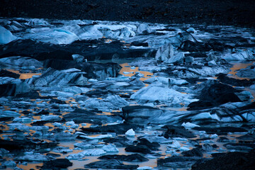 The natural wonder of a glacial lake reflecting golden light