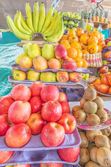 Colorful display of fresh fruits at the Otavalo market, Ecuador. A vibrant scene that conveys freshness, abundance, and natural flavor.