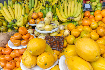 Colorful display of fresh fruits at the Otavalo market, Ecuador. A vibrant scene that conveys freshness, abundance, and natural flavor.
