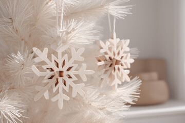 Scandinavian Christmas decor, minimalist wooden ornaments on white fir tree, neutral beige background, natural light