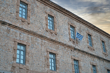 Historic stone building with blue shutters in Nafplio, Peloponnese, Greece
