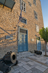 Historic stone building with blue shutters in Nafplio, Peloponnese, Greece