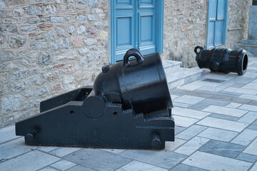 Historic stone building with blue shutters in Nafplio, Peloponnese, Greece