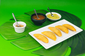 Colombian empanada with spicy sauce 