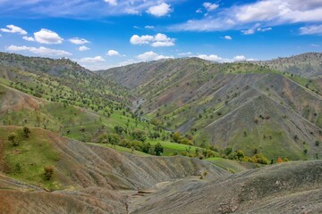 A wide-angle view of dry, rugged Zagros foothills in Kurdistan