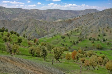 A wide-angle view of dry, rugged Zagros foothills in Kurdistan