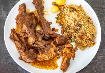 Free-range chicken prepared with its own blood sauce, known as 