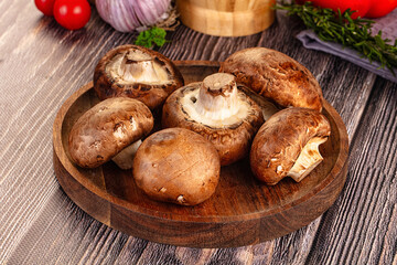 Raw brown champignon heap for cooking