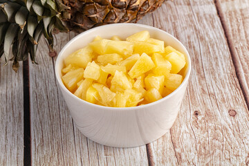 Sweet canned pineapple fruit pieces