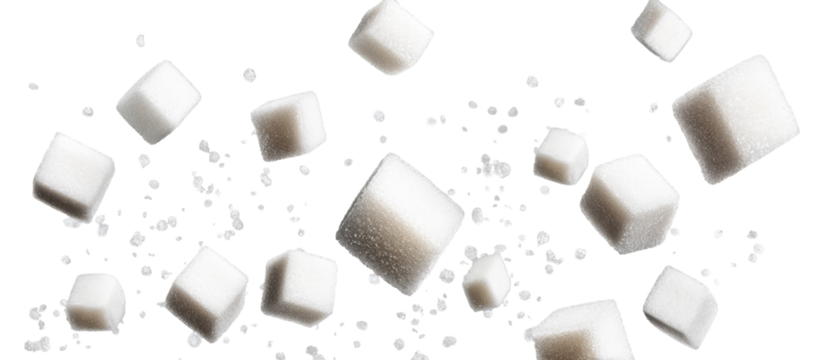 Sugar cubes in motion against a black background
