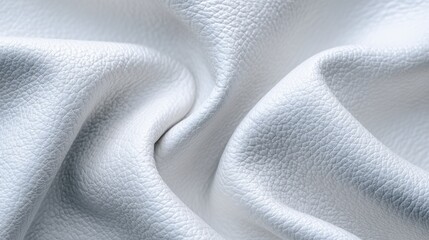 Naklejka premium Closeup of a soft, white fabric with delicate folds and subtle texture