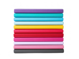 Colorful notebook stack arranged in vertical pile features vibrant covers in purple blue yellow red pink and black creating cheerful and organized office or school supply display