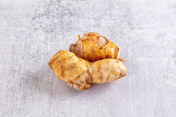 Raw galangal roots heap seasoning