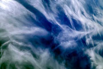 Scenic background of clear white clouds against the blue sky