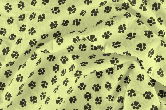 Yellow fleece blanket with white paw prints