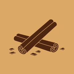 Two cinnamon sticks lie crossed with small pieces of cinnamon bark.