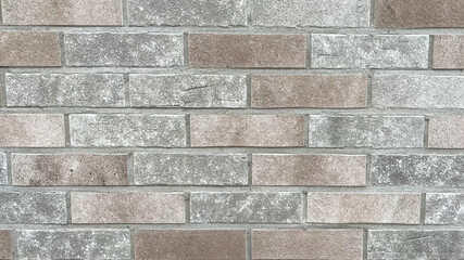 Obraz premium Modern brick wall design showcasing a blend of light and dark tones suitable for various building styles