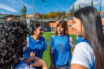 Women soccer players discussing strategy before game