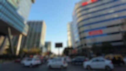 Bokeh view of road traffic in Bandra Kurla Complex area - commercial district of Mumbai, India. Blurred background footage.