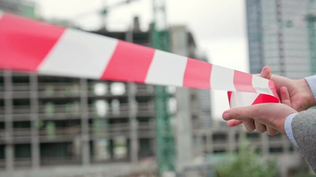 Experienced building contractor is cordoning off new construction zone