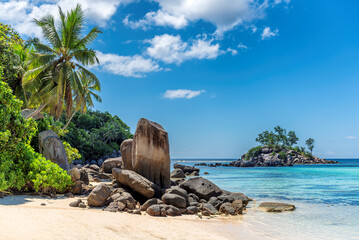 Beautiful cliffs and palm trees on a tropical island, Seychelles.