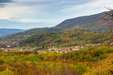 Obraz premium Balkan rural landscape with forested mountains on an autumn day