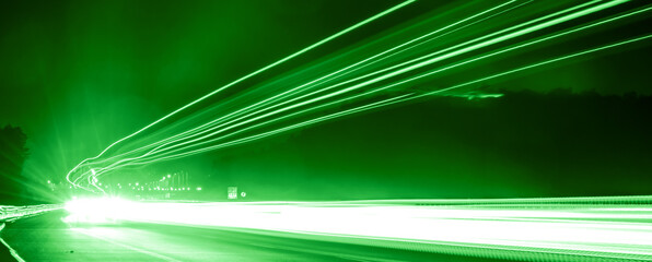 green car lights at night. long exposure
