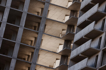 Geometric concrete structure of a building under construction.