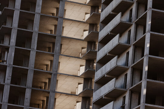 Geometric concrete structure of a building under construction.
