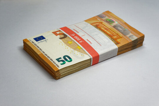 Stack of fifty euro banknotes totaling five thousand euros symbol of wealth and finance - Powered by Adobe