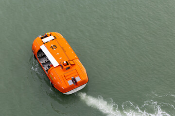 Rescue Boat Evacuating Passengers from Cruise Ship at Se