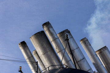 Exhaust Pipes on Top of a Cruise Ship at Sea - blue sky