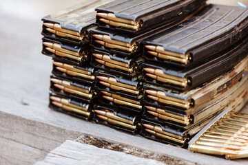 A close-up of loaded rifle magazines. Concept for strategic readiness, firepower, and defense.
