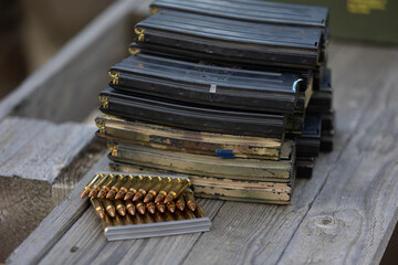 A stockpile of rifle magazines and ammo.