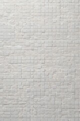 Obraz premium beige mosaic tile texture background. Neutral square pattern for interior design, bathroom walls. Light stone ceramic surface suitable for architectural rendering, flooring, kitchen backsplashes.