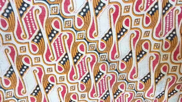 Video The parang batik motif appears abstract, with repeating patterns resembling geometric shapes. It's a traditional Indonesian motif