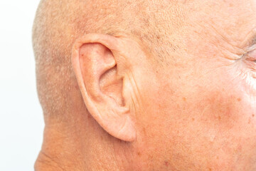 Close-up male ear, side profile mature man’s face, auditory perception, sound sensitivity, listening, poor hearing, Hearing Test, ringing or buzzing sensation, Auditory impairment, Medical condition