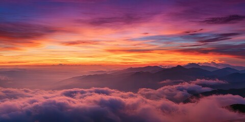 Fototapeta premium Epic view of clouds dramatically rolling over a colossal mountain range, creating a sea of clouds effect, vibrant sunset colors, high-altitude perspective, awe-inspirin