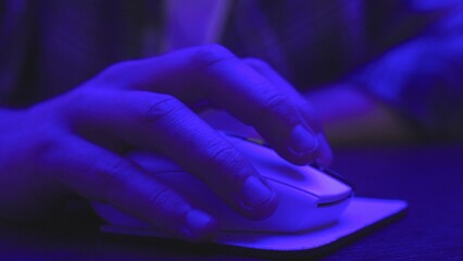 Fototapeta premium Male hand clicking mouse and sitting at desk, working online. Slow motion